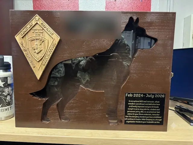 Handler Course farewell plaque: Instructor of the Year emblem, a full-size dog silhouette cut through the board and an engraved tribute.